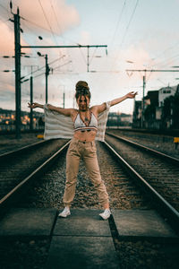 Full length of man standing at railroad station