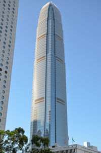 Low angle view of modern buildings against clear blue sky