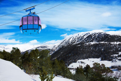 Overhead cable car against sky during winter