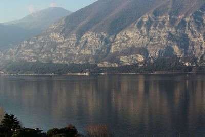 Scenic view of lake with mountains in background