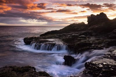 Scenic view of sea against sky during sunset