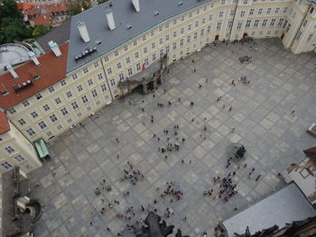 High angle view of people on street against buildings in city