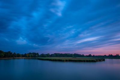 Scenic view of lake against sky during sunset