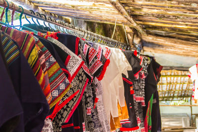 Low angle view of clothes hanging at market