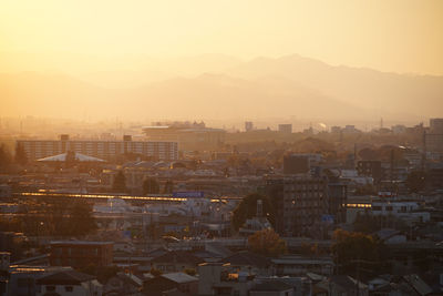 High angle view of townscape against sky during sunset