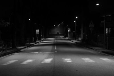 Empty illuminated corridor at night