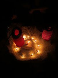 High angle view of illuminated candles