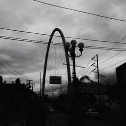 Low angle view of electricity pylon against sky