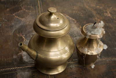 High angle view of brass tea pot