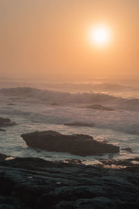 Scenic view of sea at sunset