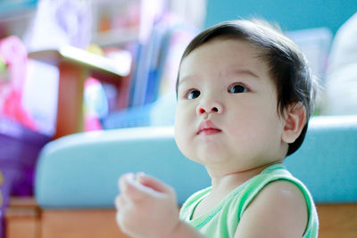 Portrait of cute baby girl at home