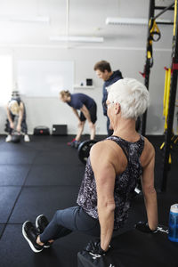 Senior woman exercising in gym