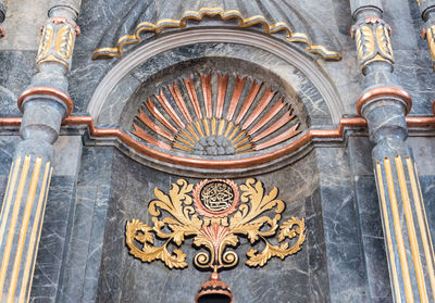 Close-up of ornate entrance against building