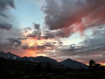 Scenic view of mountains against cloudy sky