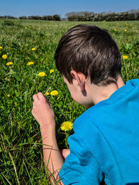 Close-up of boy on grassy field