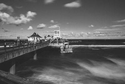 Pier over sea against sky