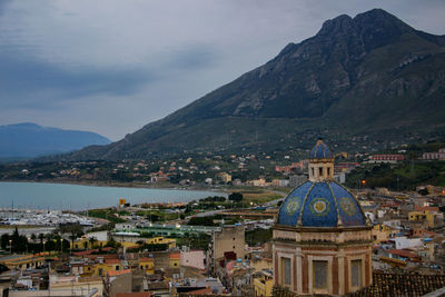 High angle view of church against cloudy sky