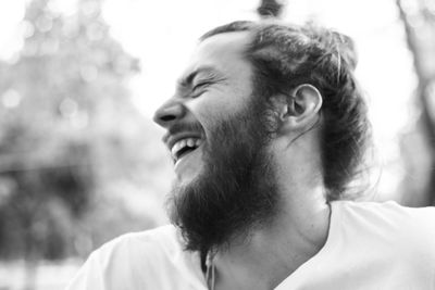 Close-up of laughing man with beard