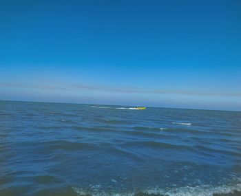 Scenic view of sea against blue sky