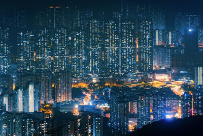 High angle view of illuminated buildings in city at night