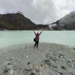 Kawah putih  bandung indonesia - rear view of woman standing at beach