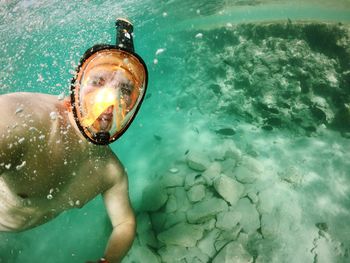 High angle view of man swimming in pool