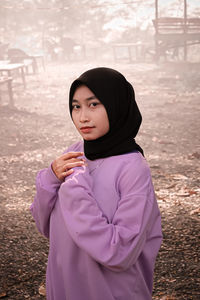 Full length of woman standing on field