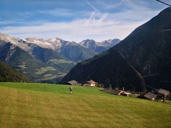 Scenic view of landscape and mountains against sky