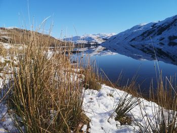 Scenic view of frozen lake against sky