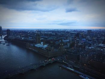 High angle view of cityscape against cloudy sky