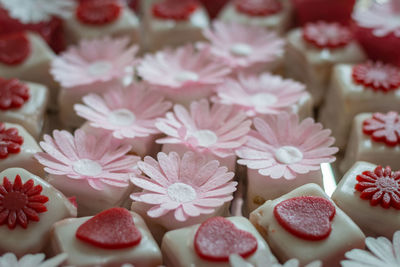 Colorful petit fours with flower decoration