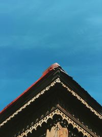 Low angle view of building roof against sky