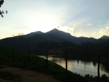 Scenic view of lake against sky during sunset