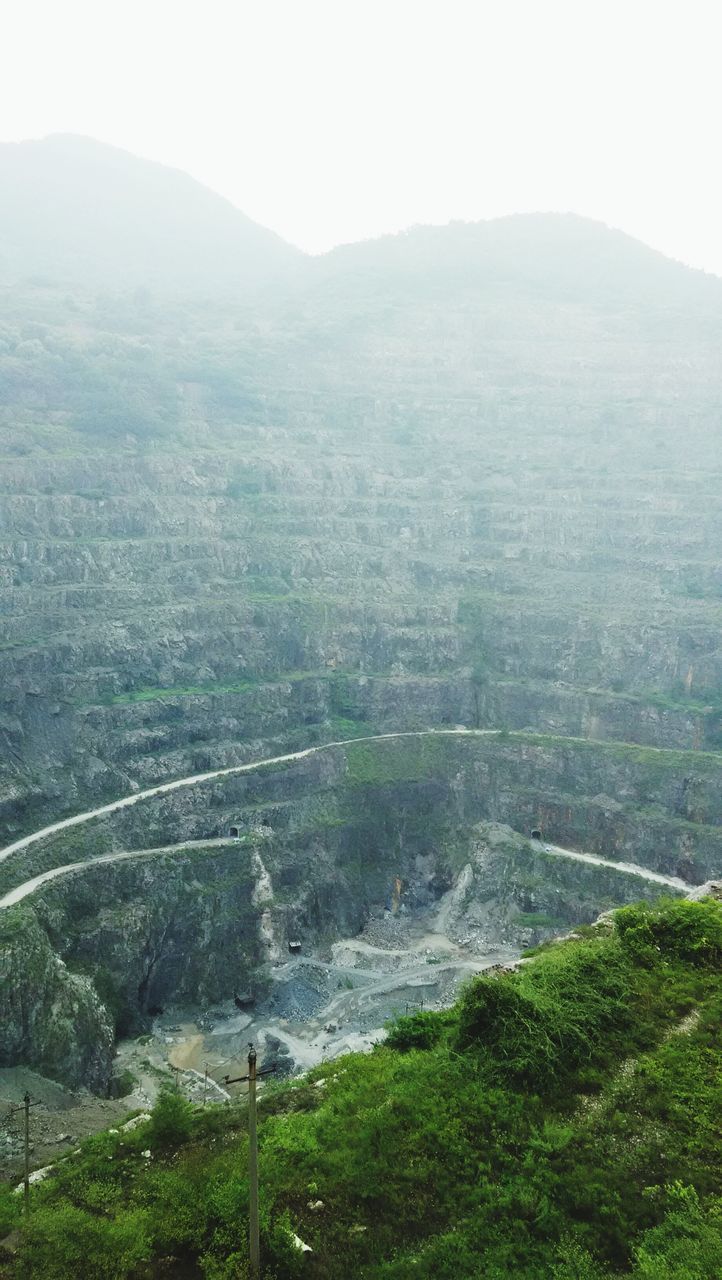 mountain, landscape, tranquil scene, tranquility, scenics, beauty in nature, fog, nature, high angle view, tree, mountain range, non-urban scene, foggy, valley, hill, green color, growth, remote, day