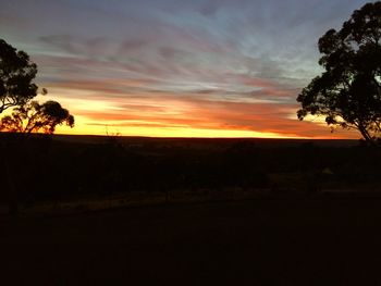 Scenic view of silhouette landscape against sky during sunset