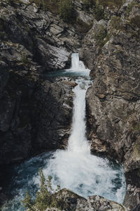 View of waterfall along rocks