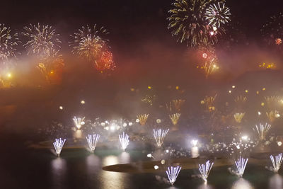 Firework display at night