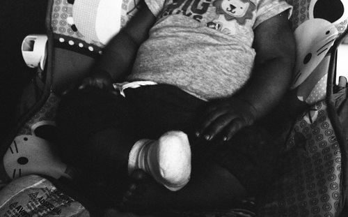 Close-up of two people sitting in bus