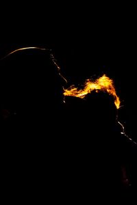 Silhouette of fire at night