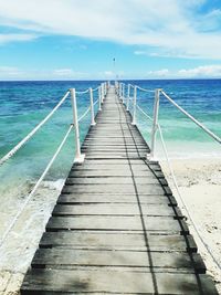 Pier over sea against sky