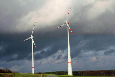 Low angle view of windmill against sky