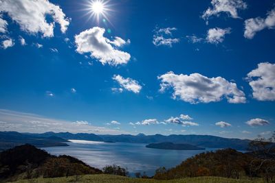 Scenic view of mountains against blue sky