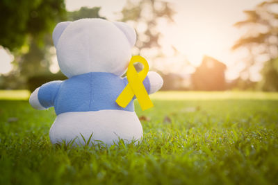 Close-up of stuffed toy on field