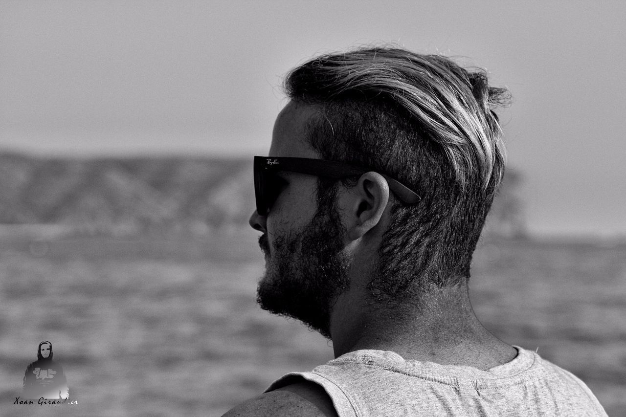 headshot, focus on foreground, portrait, one person, water, sky, lifestyles, young adult, real people, sea, glasses, young men, leisure activity, nature, men, sunglasses, beard, fashion, outdoors