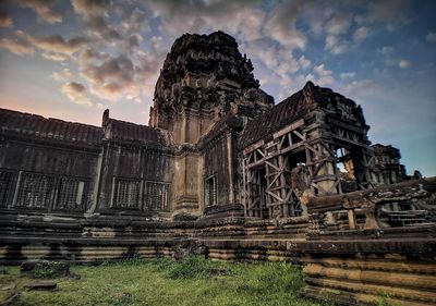 Low angle view of old building against sky