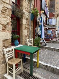 Potted plants on table against building