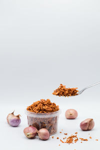 Close-up of food on table against white background
