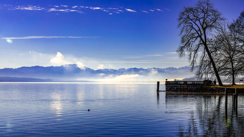 Scenic view of lake against blue sky