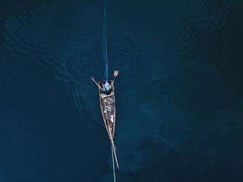 Aerial view of woman on boat sailing in river