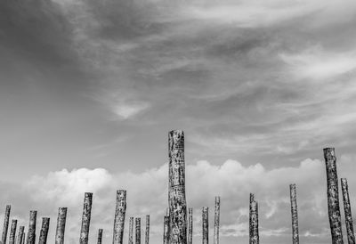 Panoramic view of skyscrapers against cloudy sky